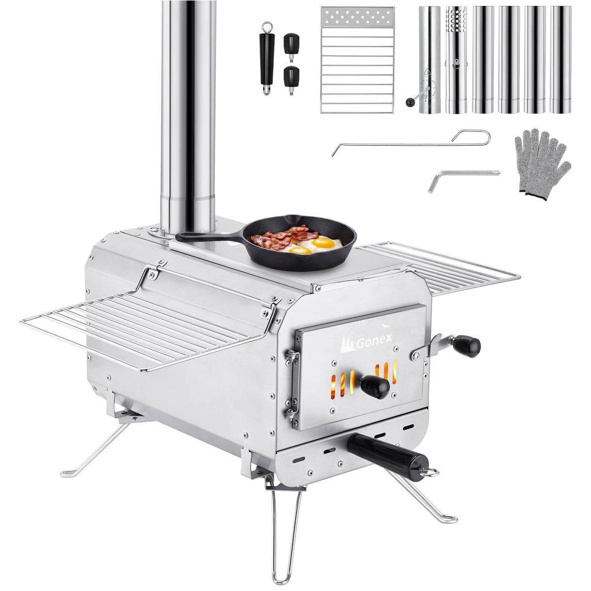 A portable stainless steel wood-burning stove with a chimney pipe, side shelves, a frying pan on top, and several accessories shown around it on a white background. The stove has the brand name &